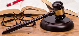 Wooden judge gavel on a legal document inside a UK courtroom