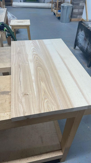 Smooth wooden tabletop with light and dark grain patterns