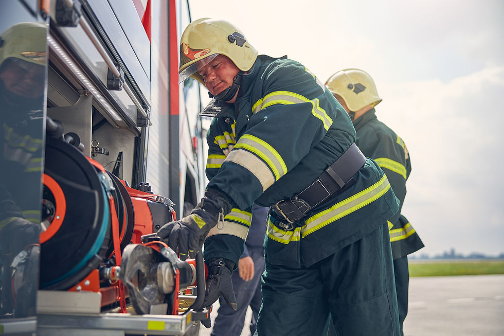 firefighter-installing-equipment-on-the-fire-machi-2023-11-27-05-25-48-utc.jpg
