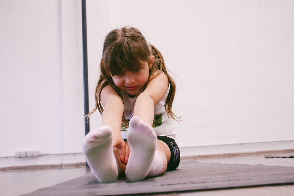 Kids in a minimal sunlit dance studio