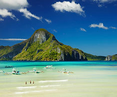 "Crystal-clear waters and dramatic limestone cliffs of Palawan, Philippines – a paradise for beach lovers and divers"