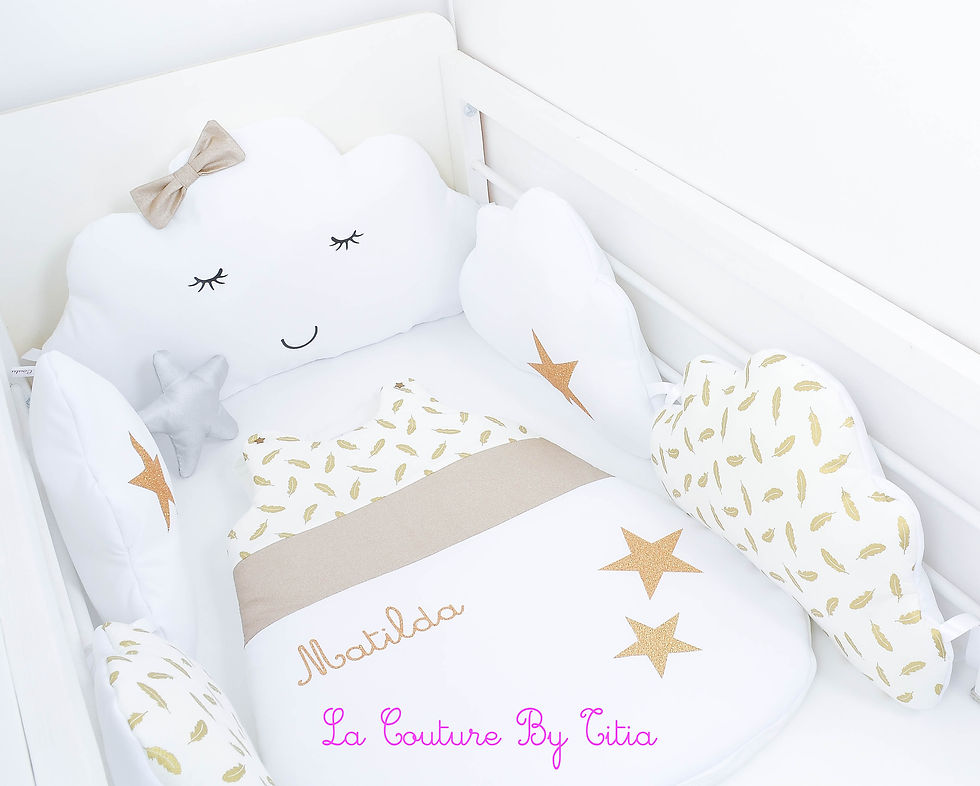 Thumbnail: Cloud bed bumper and white sleeping bag, gold feathers and golden stars