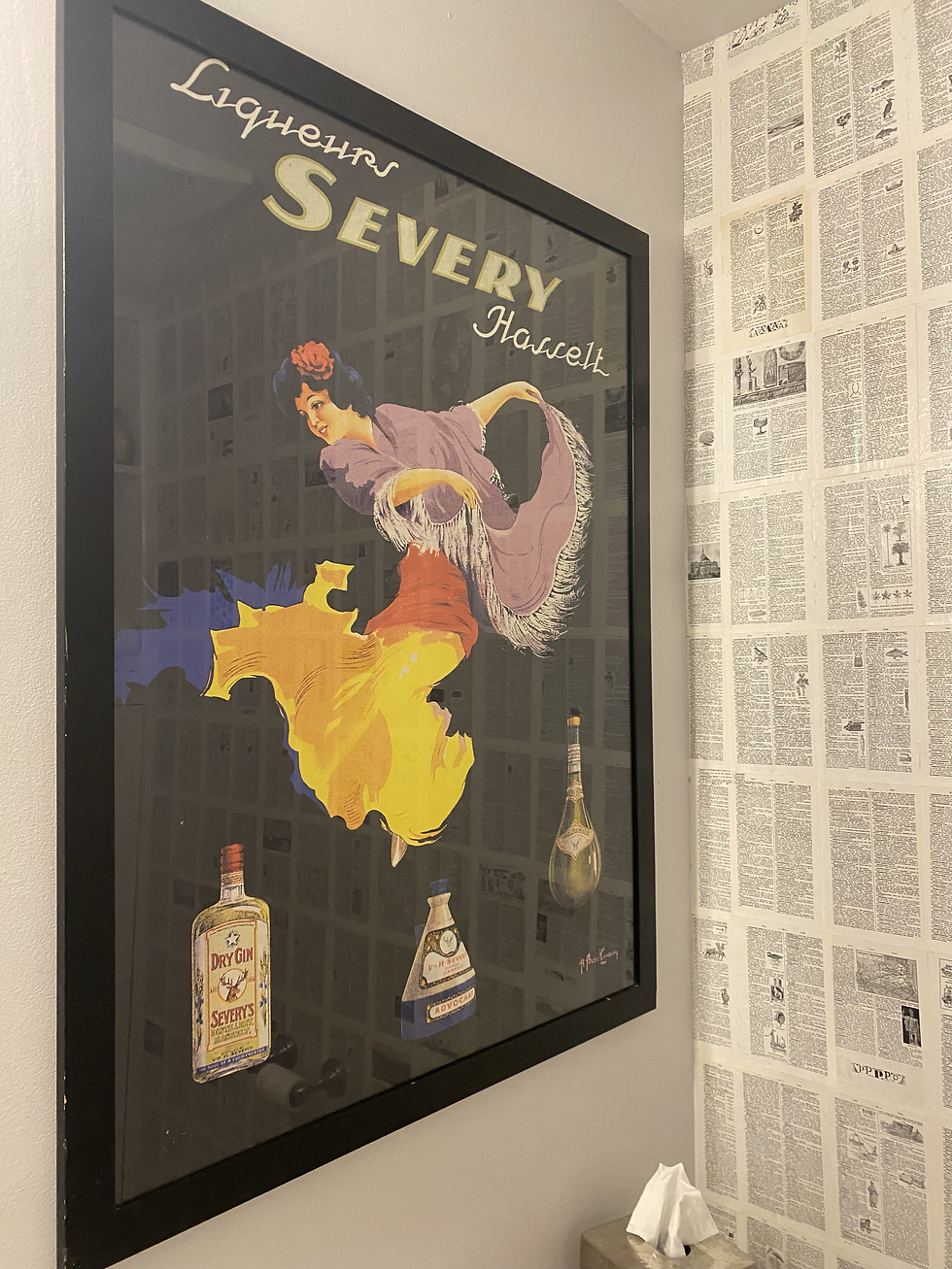 framed art of a vintage french liquor advertisement