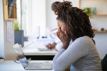 woman sitting in front of laptop