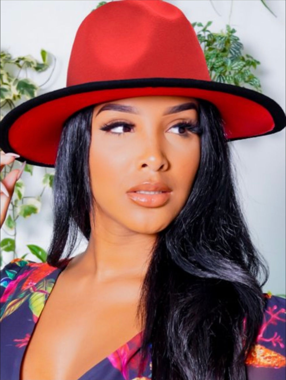 Young woman in red hat looking forward with natural makeup