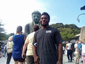 Alec next to the big buddah
