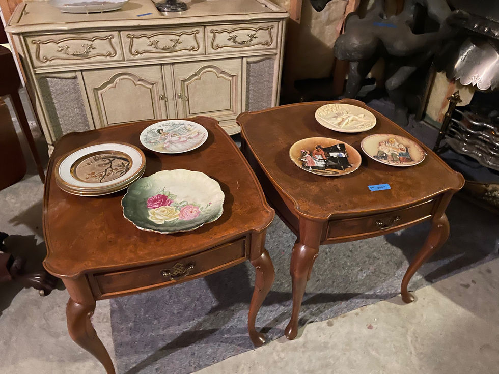 two tables with plates on them one of which has a tag that says ' a ' on it