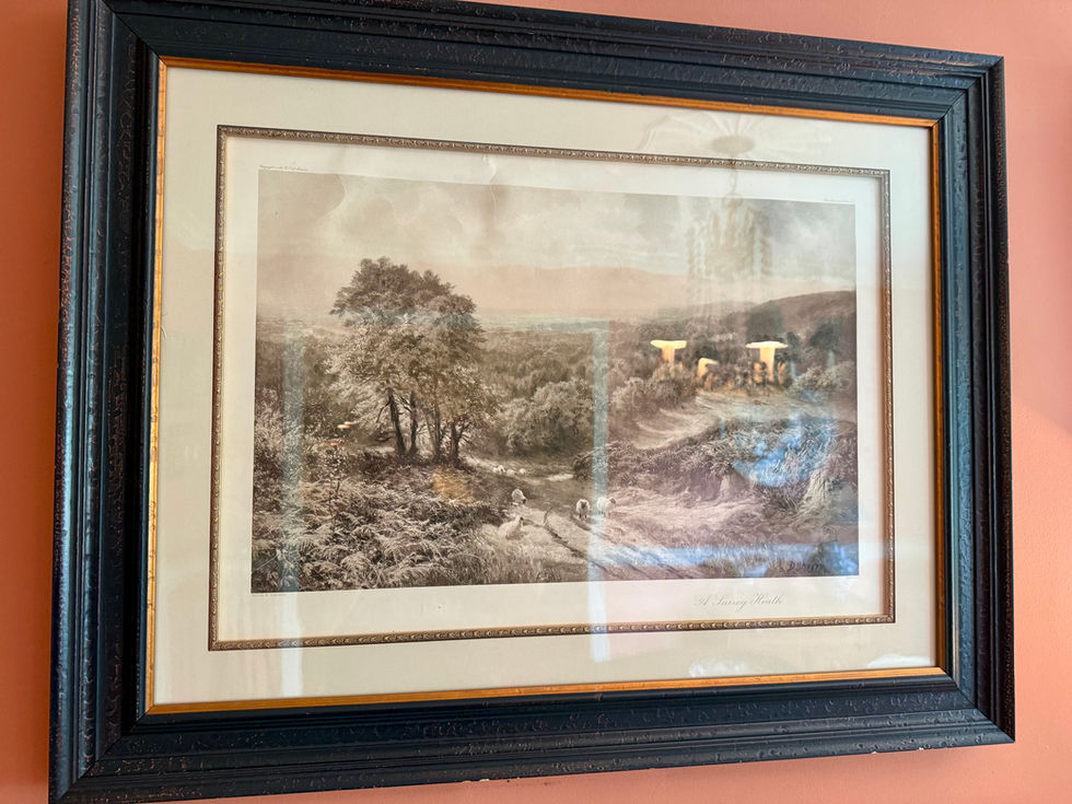 Framed landscape painting with trees and winding path.