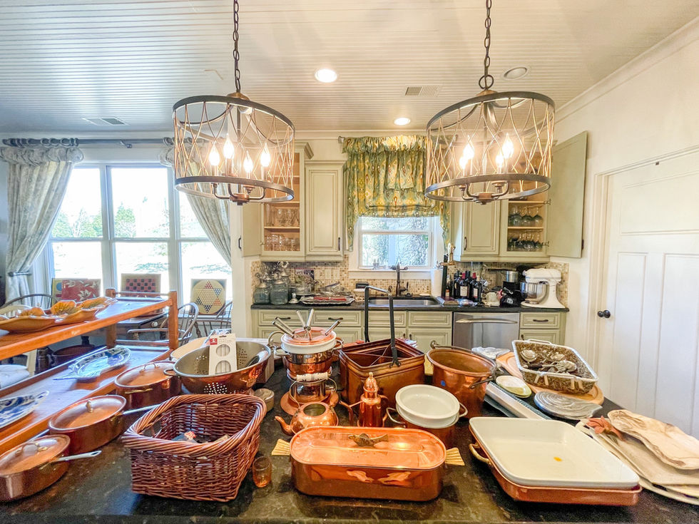 a kitchen with a lot of pots and pans on the counter