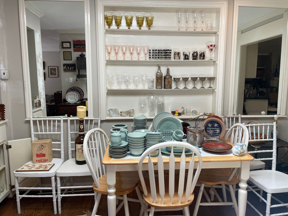 a bottle of jameson sits on a table in a dining room
