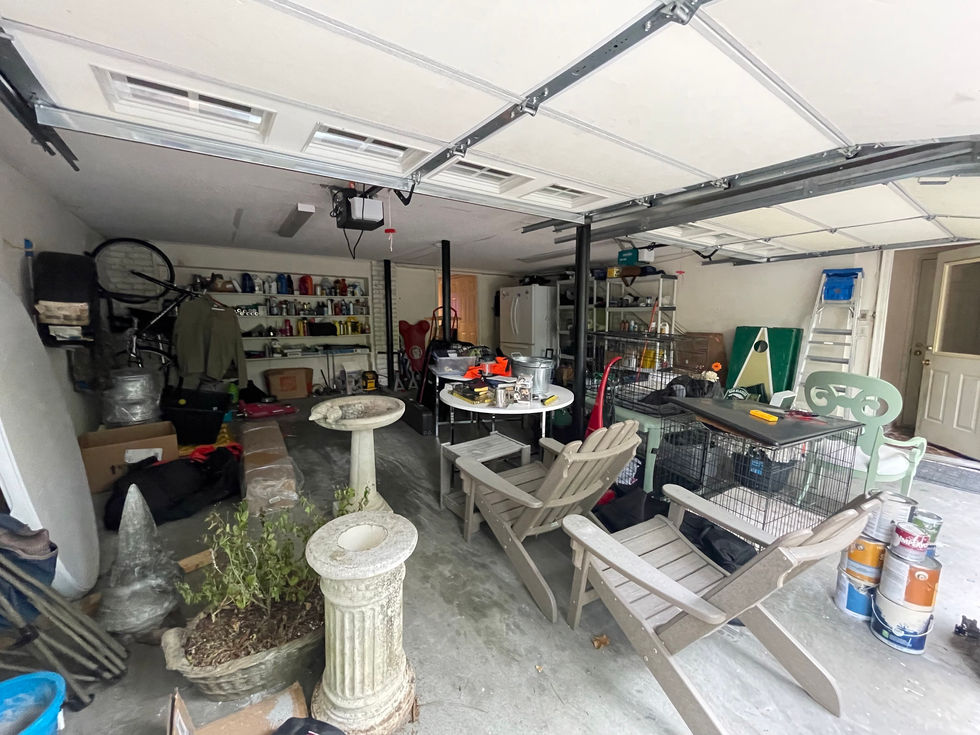 a garage with a table and chairs and a bird bath