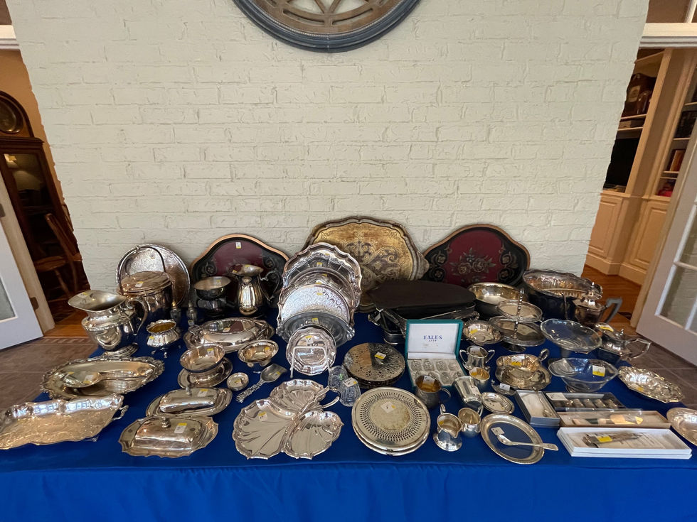 a table full of silverware and a sign that says ellen