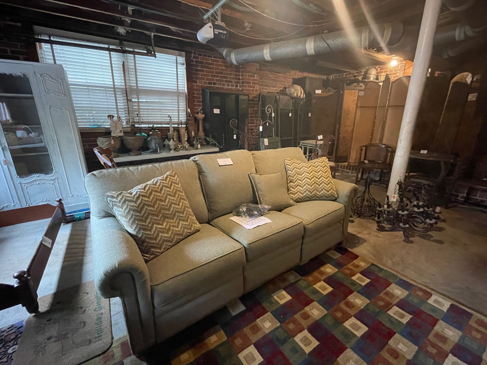 a couch in a room with a rug that says holiday time