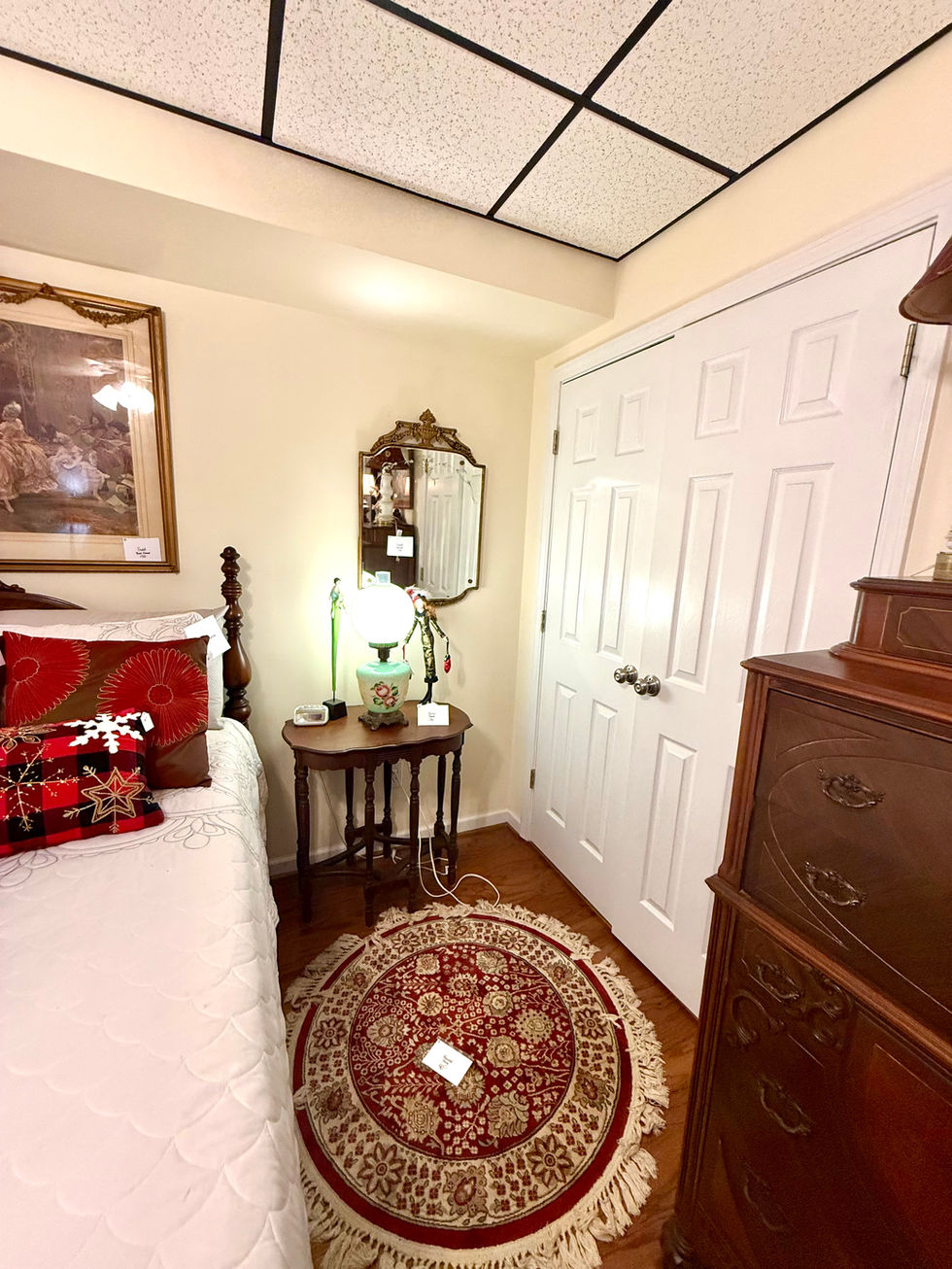 Cozy bedroom corner with vintage decor and furniture.