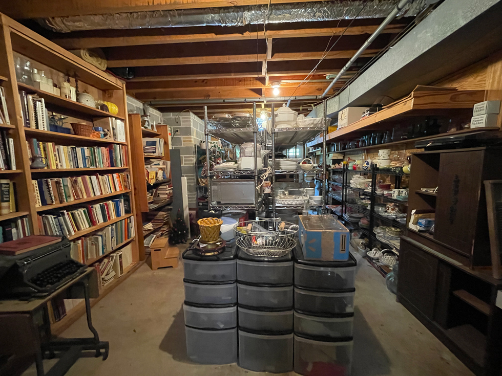 a room filled with lots of items including a box that says ' a ' on it