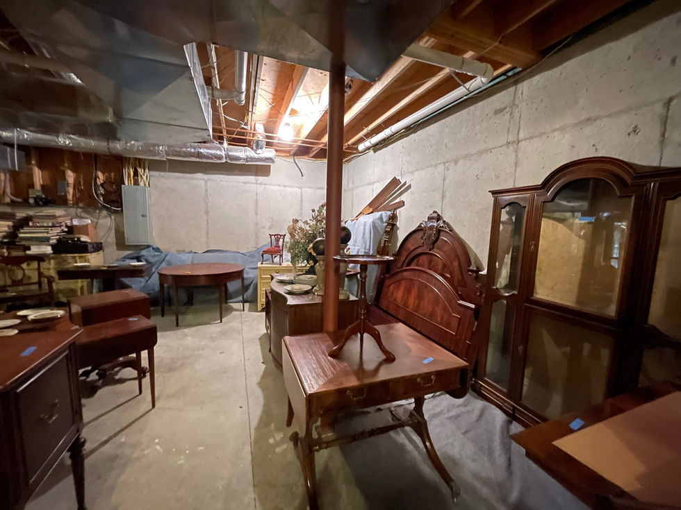 a room filled with lots of furniture including a bed