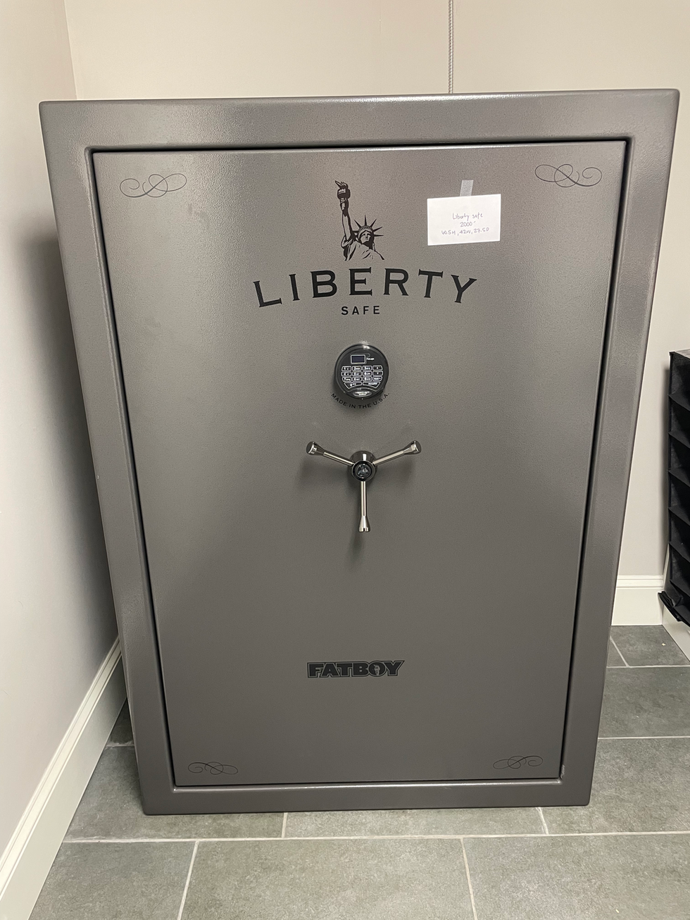 a liberty safe with a note taped to it