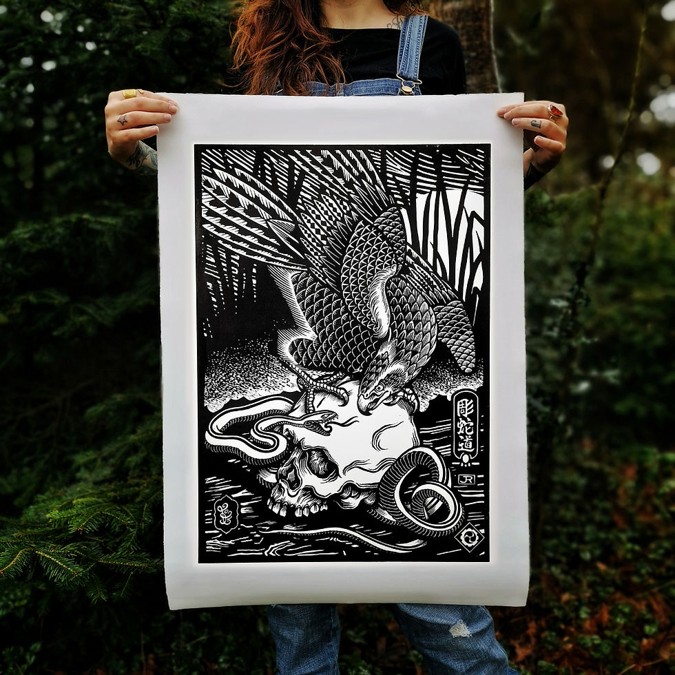Thumbnail: girl holding linoleum print of japanese hawk, snake and skull