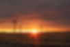 sunset over wind turbines
