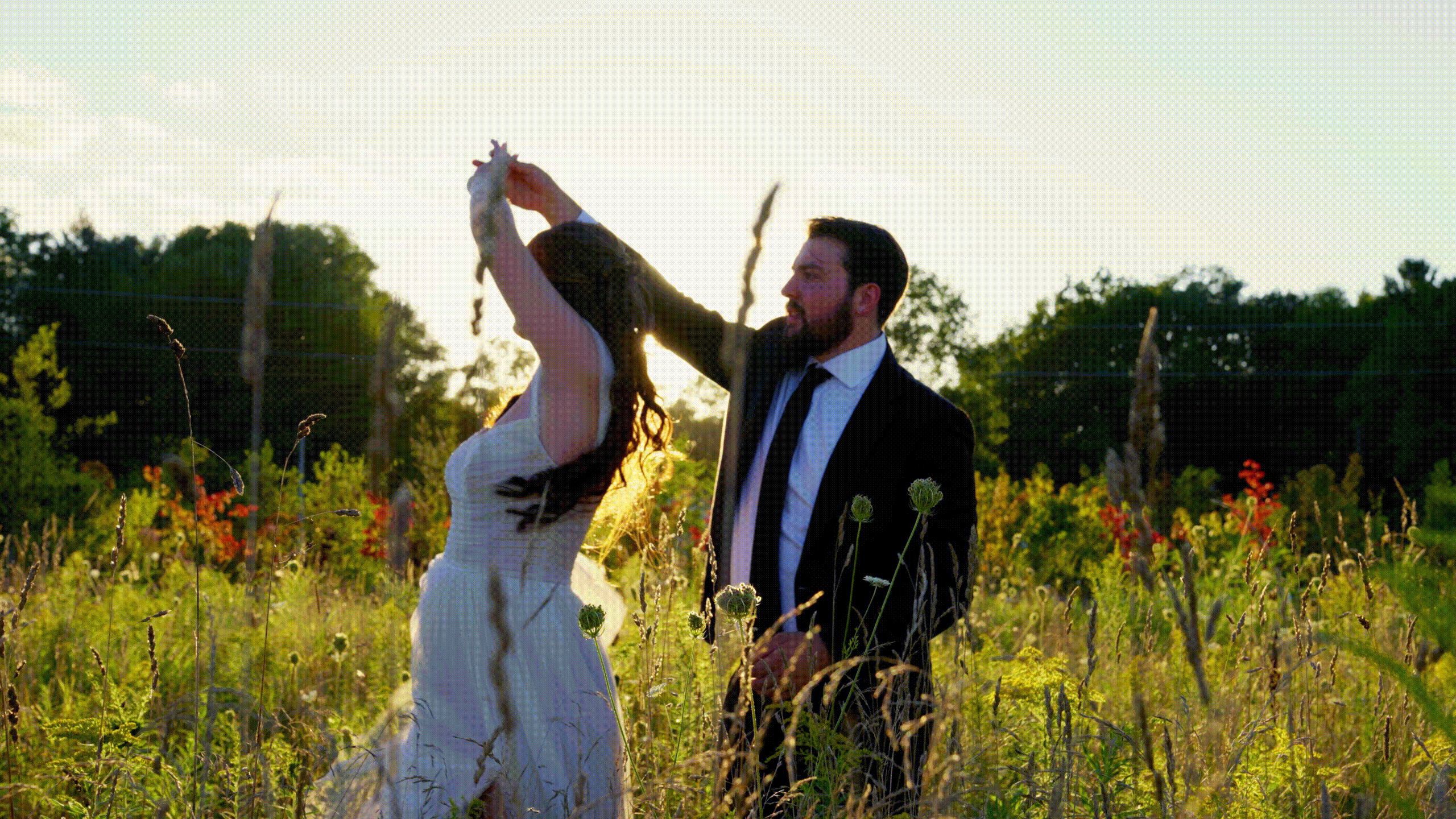 Bride and groom twirling together during their wedding day in Michigan