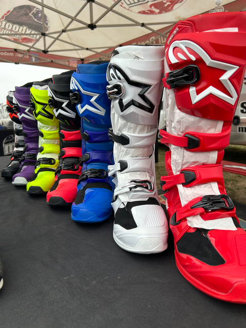 Rider checking out Alpinestars Tech 7 boots at MxBoot.com track setup