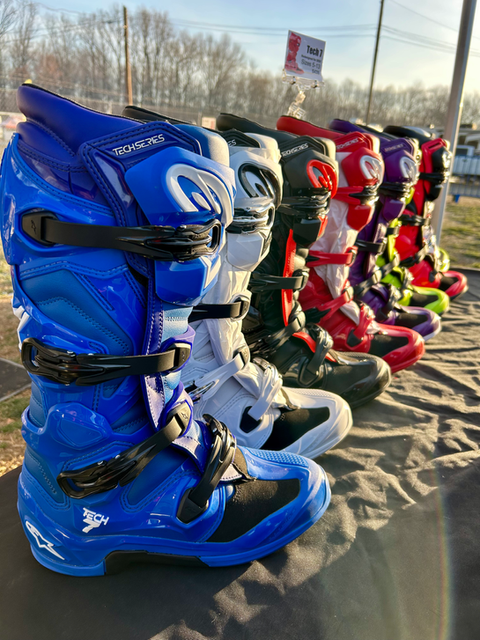 Tech 7 Alpinestars boots displayed by MxBoot.com at motocross event