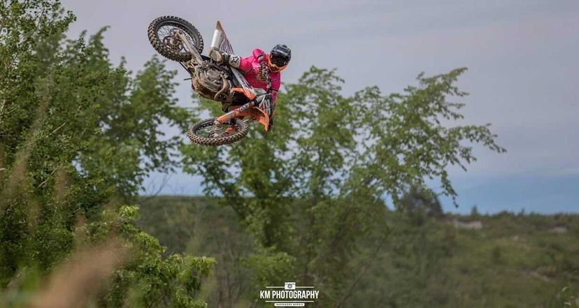 Motocross Rider throwing a whip