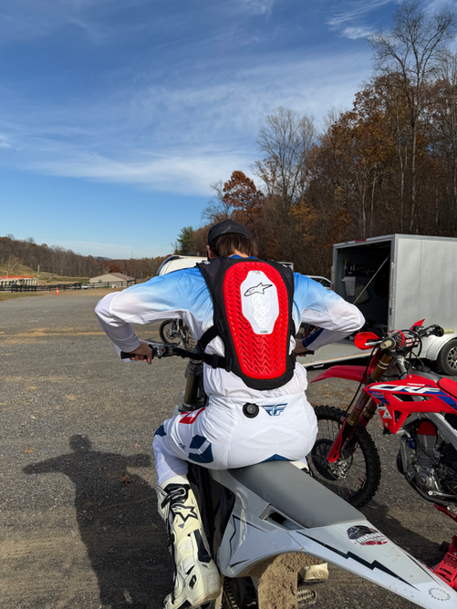 Detailed rear view of the Alpinestars Tech Air MX motocross airbag vest showing airbag coverage – MxBoot.com