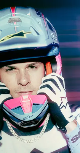 Front-facing Alpinestars S‑M10 Jett Lawrence R01 helmet showcasing visor opening and colorful graphic accents