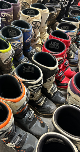 Used dirt bike boots organized and ready to ship
