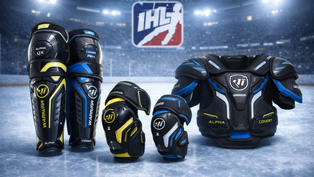 Hockey gear set on ice arena. Black, yellow, and blue colors. "Warrior" branding visible. Stadium lights and "IHL" logo in background.