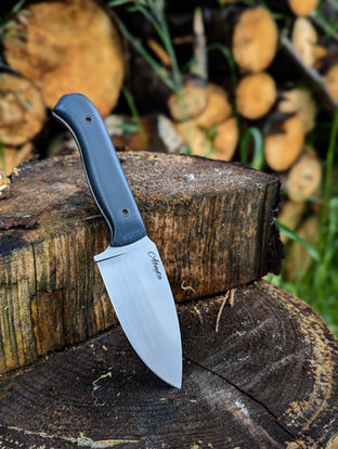 Custom made hunting knife. Rich blue synthetic  handle paired with matte black gulso bolts offers maximum material quality while paired with expert hand-finished craftsmanship. Alberta made bushcraft knife, 