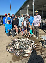 Large corporate fishing group preparing for guided trip