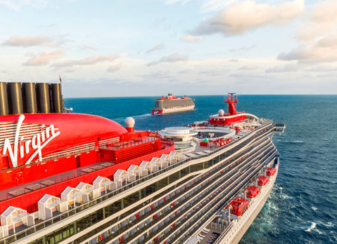 Air view of 2 Virgin Voyages ships at sea