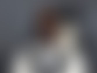 eatured image for a blog post about rapper Offset, showing a smiling man in dark sunglasses and a white tuxedo-style jacket at a formal event