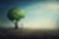 Surreal brain tree in a desolate land and a determined person watering it using a sprinkli
