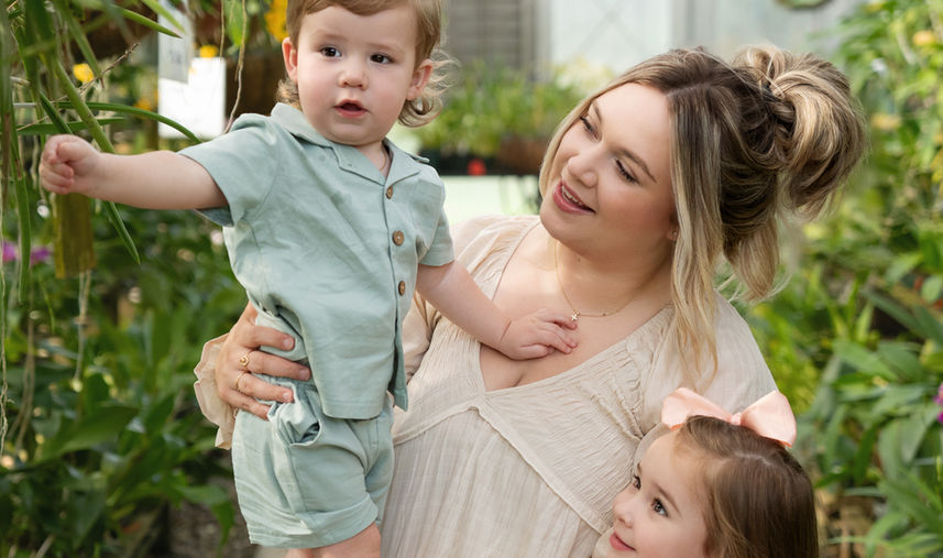 Mother interacting with her children inside the orchid house at South Texas Botanical Gardens