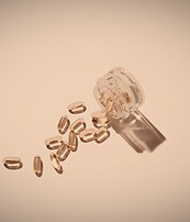 Personal care capsules arranged on a neutral background