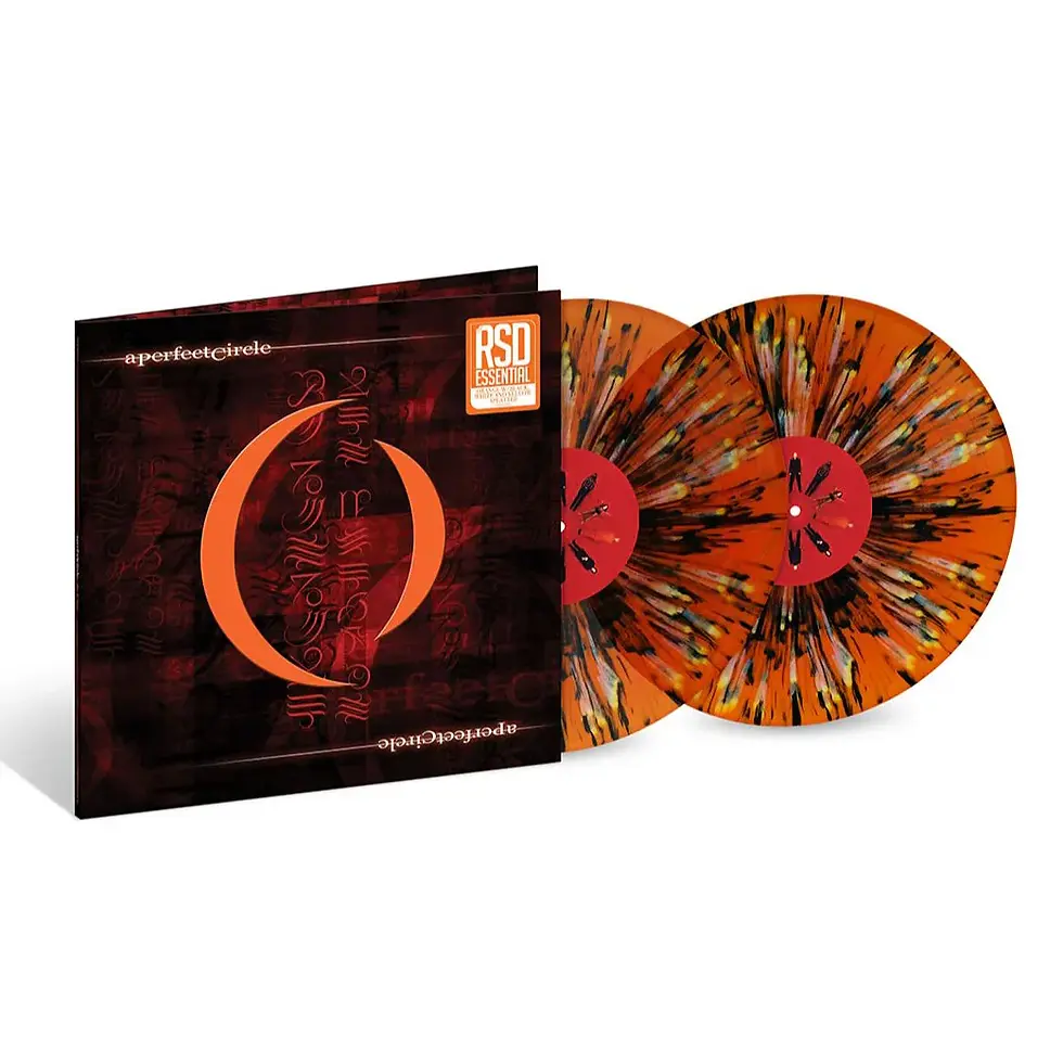 Close-up of the A Perfect Circle Mer De Noms orange black white and yellow splatter vinyl record