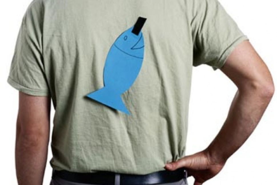 Yes, this man really does have a paper fish taped to his back. It’s an April Fools’ Day thing. Sorry, we mean April Fish Day