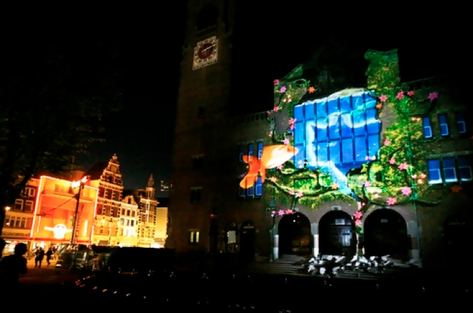 Projection mapping on the face of a building evokes an inviting display to make an impression. 
