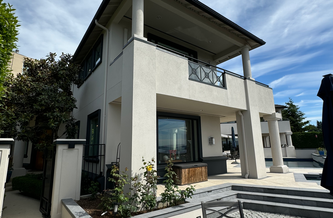 Professional stucco painting team applying high-performance coatings in Kirkland, WA.