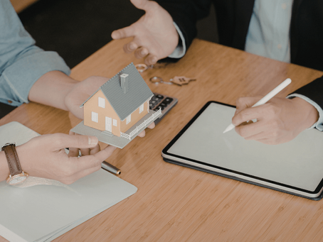 Landlord and agent discussing Guaranteed Rent vs Traditional Letting