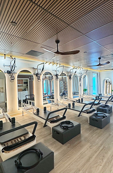 Lighted Mirrors Inside Modern Art of Pilates Studio