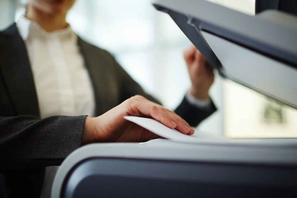 Woman Using Copier