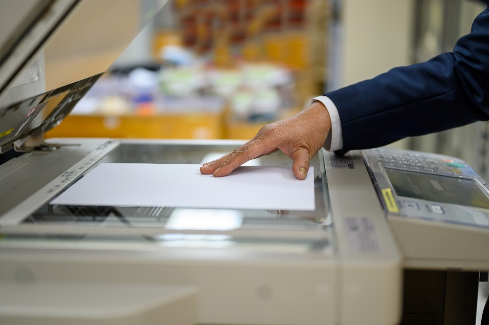 Employee using copy machine