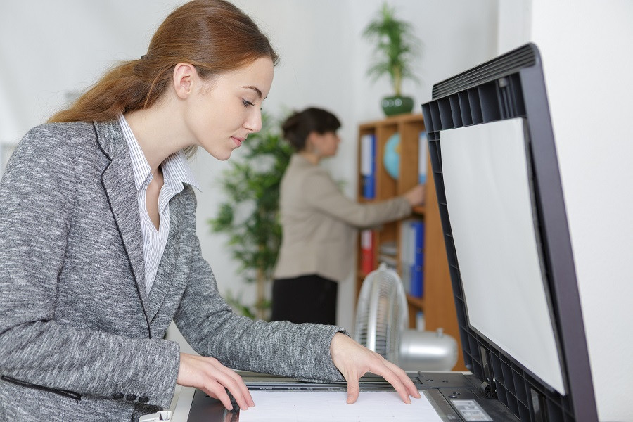 Employee Using Copier Machine