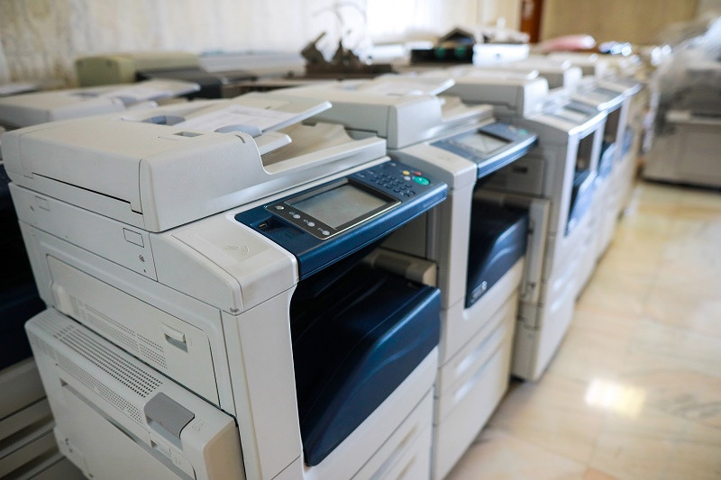 Several large copy machines in a row