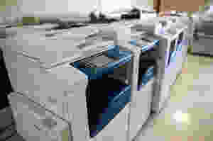 Several large copy machines in a row