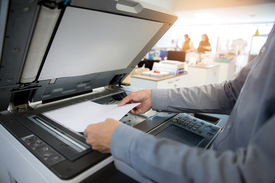 Man making copies on machine